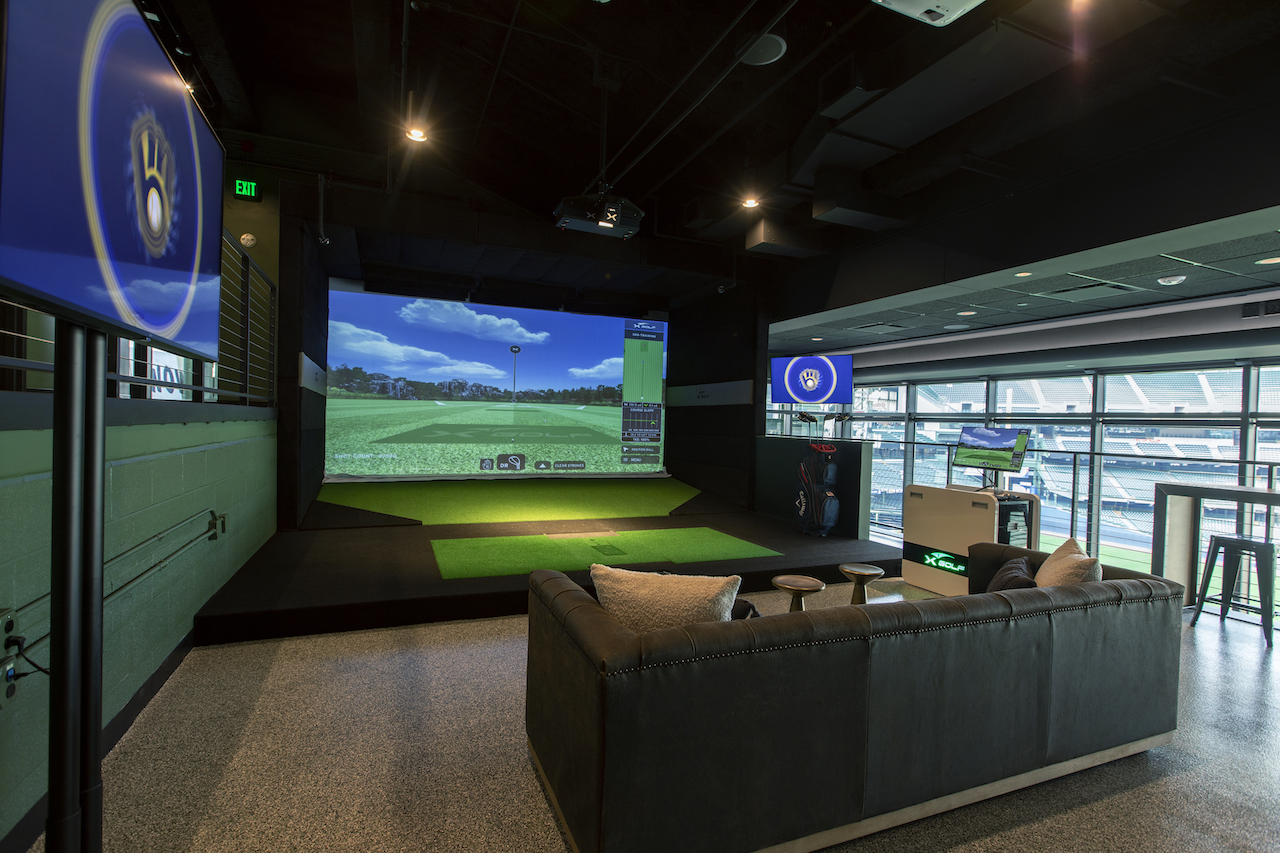 Your own private golf simulator and clubs.